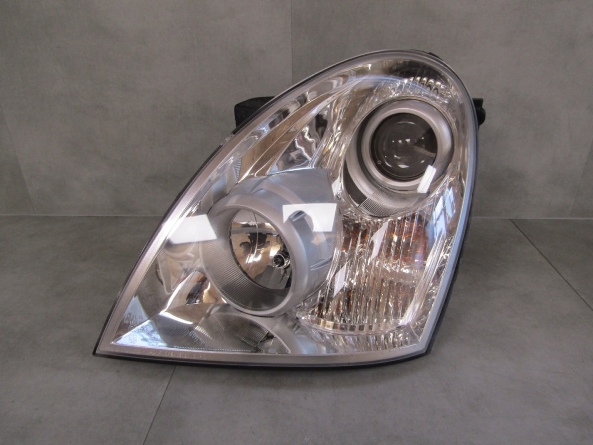 Prednji far Ssangyong Rexton LIFT halogen 06-12 LH